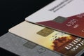 A lot of different bank credit cards with chips on a black