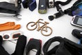 A lot of different bicycle accessories lying on wooden table Royalty Free Stock Photo