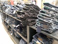 Lot of different color striped long sleeve,blue jeans shirts are neatly stacked in a row on the store shelves