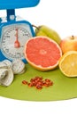 A lot of different fruits, pills and scale Royalty Free Stock Photo