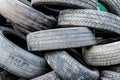 A lot of different old, dirty worn out car tires in a landfill