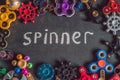 A lot of different spinners on a black background And the inscription spinner Royalty Free Stock Photo