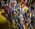 A lot dirty artist paint brushes in a bucket