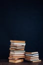 A lot of educational books for exams at the university on the black background of the library Royalty Free Stock Photo