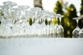 A lot of empty wine glasses. Row of clean glass transparent glasses are on a table on banquet in a bar Royalty Free Stock Photo