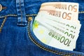 A lot of euro money in a pocket of jeans trousers Royalty Free Stock Photo