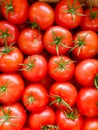 a lot of evenly stacked beautiful ripe bright red cherry tomatoes Royalty Free Stock Photo