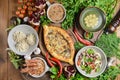 A lot of food on the wooden table. Georgian cuisine. Top view, flat lay Royalty Free Stock Photo