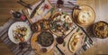 A lot of food on the wooden table. Georgian cuisine. Top view. Flat lay . Khinkali and Georgian dishes Royalty Free Stock Photo