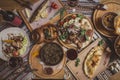 A lot of food on the wooden table. Georgian cuisine. Top view. Flat lay . Khinkali and Georgian dishes Royalty Free Stock Photo