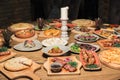 A lot of food on the wooden table. Georgian cuisine. Top view. Flat lay . Khinkali and Georgian dishes