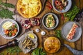 A lot of food on the wooden table. Georgian cuisine. Top view. Flat lay. Khinkali and Georgian dishes Royalty Free Stock Photo