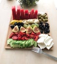 Delicious fruits and cheese plate