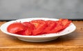 Lot of fruit flies Drosophila melanogaster eating of slices of tomatoes. Royalty Free Stock Photo