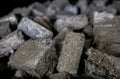 A lot of fuel briquettes from pressed sawdust. Briquettes for the oven close-up Royalty Free Stock Photo