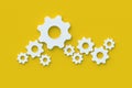 Lot of gears on yellow background. Engineering technology. Mechanism development. Industrial progress