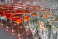 A lot of glasses with alcohol, white wine glasses crossing red wine glasses Royalty Free Stock Photo