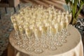 A lot of glasses with champagne on the table. Buffet table with glasses of champagne