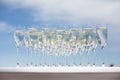 Lot of glasses with champagne on a table outside