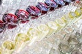 A lot of glasses with white wine and red wine glasses in a row Royalty Free Stock Photo