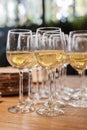A lot of glasses with white wine in a restaurant at a buffet or banquet Royalty Free Stock Photo