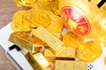 A lot of gold bars and coins are next to the piggy bank Royalty Free Stock Photo