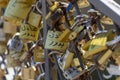 lot of Golden locks hanging on the bars on the bridge