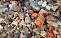 A lot of granite cobblestones on the ground or broken road, fragments of bricks, can be used Royalty Free Stock Photo