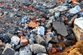 A lot of granite cobblestones on the ground or broken road, fragments of bricks, can be used as a background or texture Royalty Free Stock Photo