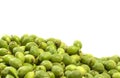 A lot green young walnuts in husks on white background Royalty Free Stock Photo