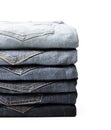 Lot of grey used women jeans stacked in a pile isolated on white Royalty Free Stock Photo