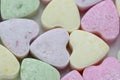 a lot of heart-shaped candies as a background, studio shooting 3