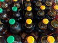 A lot of home brewery self made beer. Many brown glass craft beer bottles with green and orange corks, close up top view on a Royalty Free Stock Photo