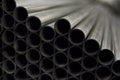 Lot of industrial metal steel pipes tubes for production for heating or engineering industry processing cutting welding and other Royalty Free Stock Photo