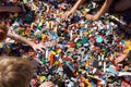 Kids hands reaching for lego blocks