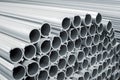 A lot of large aluminum pipes at a machine-building plant