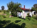 Lot of laundry hanging and drying in the yard on a sunny day Royalty Free Stock Photo