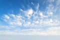 A lot of light semitransparent clouds floating high in a blue sky. Scenic cloudscape on a sunny autumn day. Different cloud