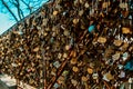 A lot of locks with the names of lovers on the bridge in Paris on montmarte near the Basilica church