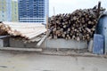 A lot of long wooden natural planed logs and boards at a sawmill. The background. Texture. Concept: timber harvesting for the wood