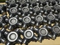 lot of mechanical components of a steering swivel, assembly line, spare parts, automotive sector, metal cross heads