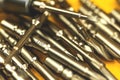 Lot of metal replaceable bits for screwdriver background Royalty Free Stock Photo