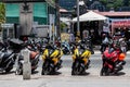 A lot of mopeds for rent stand near the road waiting for tourists in thailand