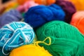 A lot of multi-colored balls of wool for knitting close-up.