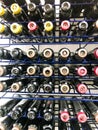 A lot of multi-colored metal cylinders with paint for coloring hair of all colors and palettes in a beauty salon. The background.