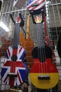 Multi-colored ukulele and guitars in a musical instrument store Royalty Free Stock Photo