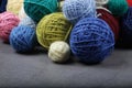 A lot of multi-colored yarn balls on the dark background. Royalty Free Stock Photo