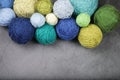 A lot of multi-colored yarn balls on the dark background. Royalty Free Stock Photo