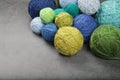 A lot of multi-colored yarn balls on the dark background. Royalty Free Stock Photo