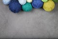 A lot of multi-colored yarn balls on the dark background. Royalty Free Stock Photo